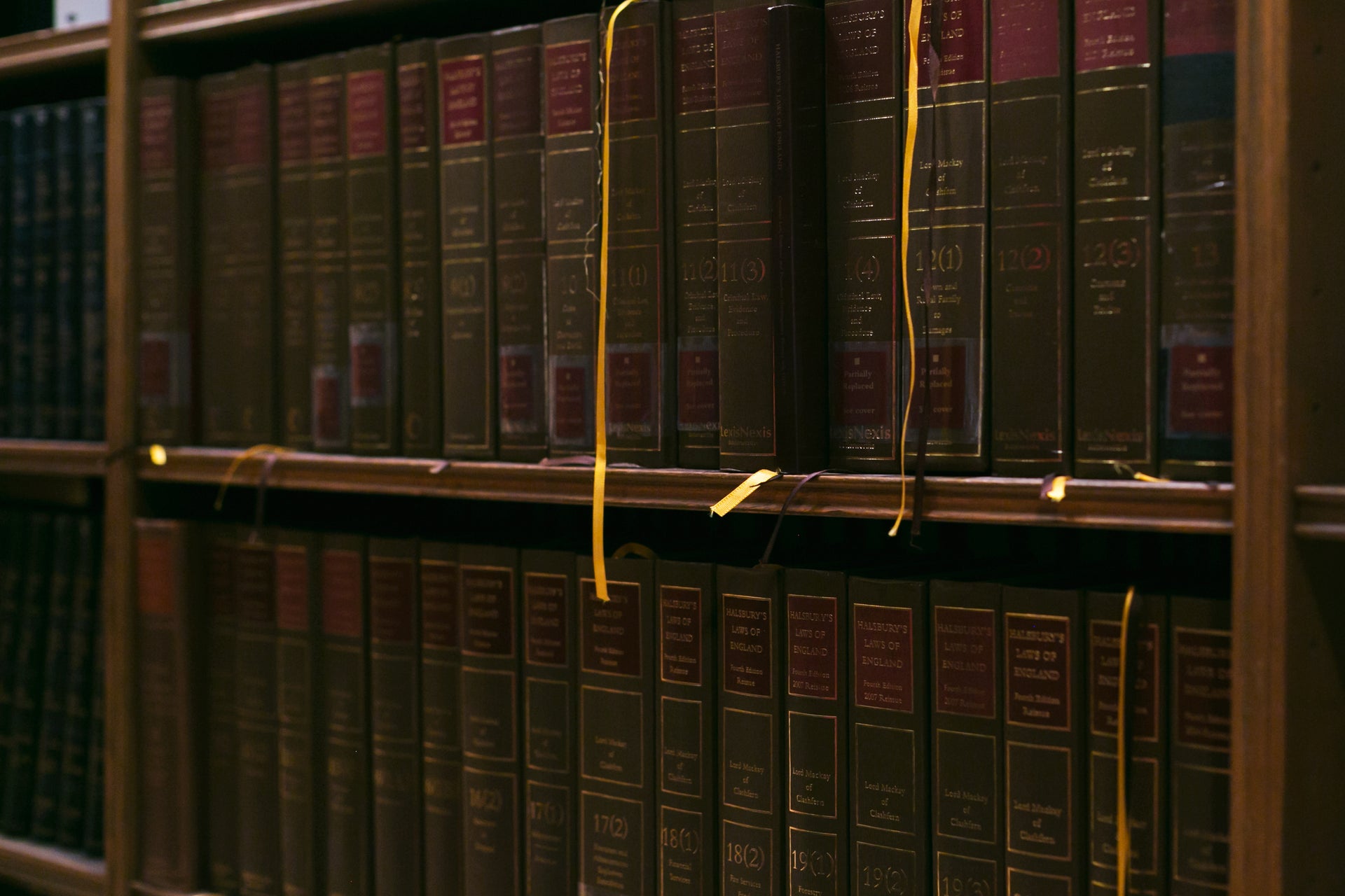 Collection of books on a bookshelf, representing resources for TOEIC test preparation.